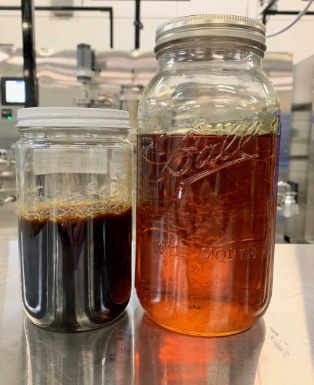 two jars of dark and light colored hemp distillate